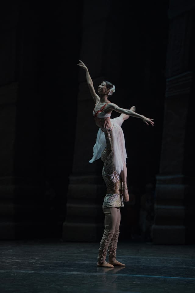 Justina performing ballet on stage